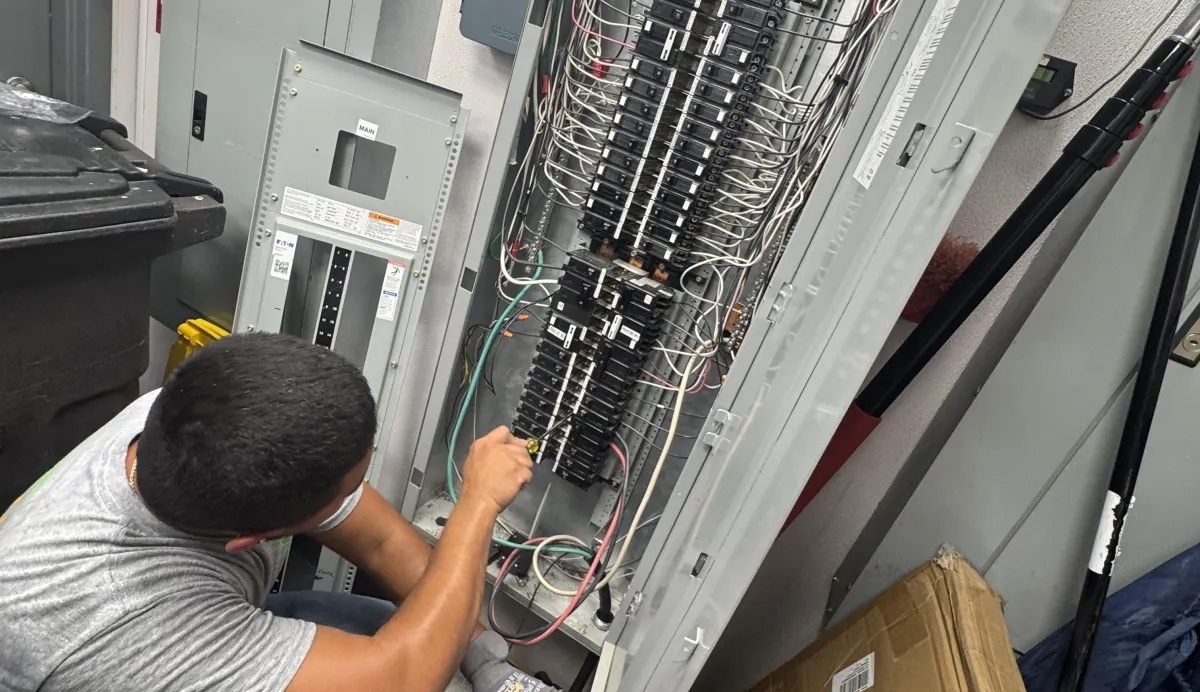Electrical-Panels Person working on electrical panel