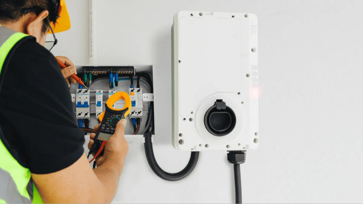 Professional-Electrician-to-Install-Your-EV-Charger Electrician installing EV charger equipment.