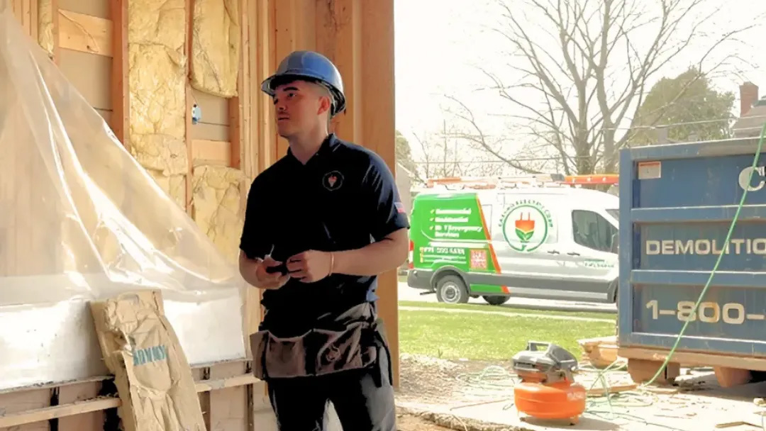 Questions-to-Ask-Before-Hiring-an-Electrician Construction worker in a building site.