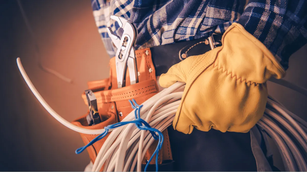 Electrical-Upgrades Electrician with tools and cables