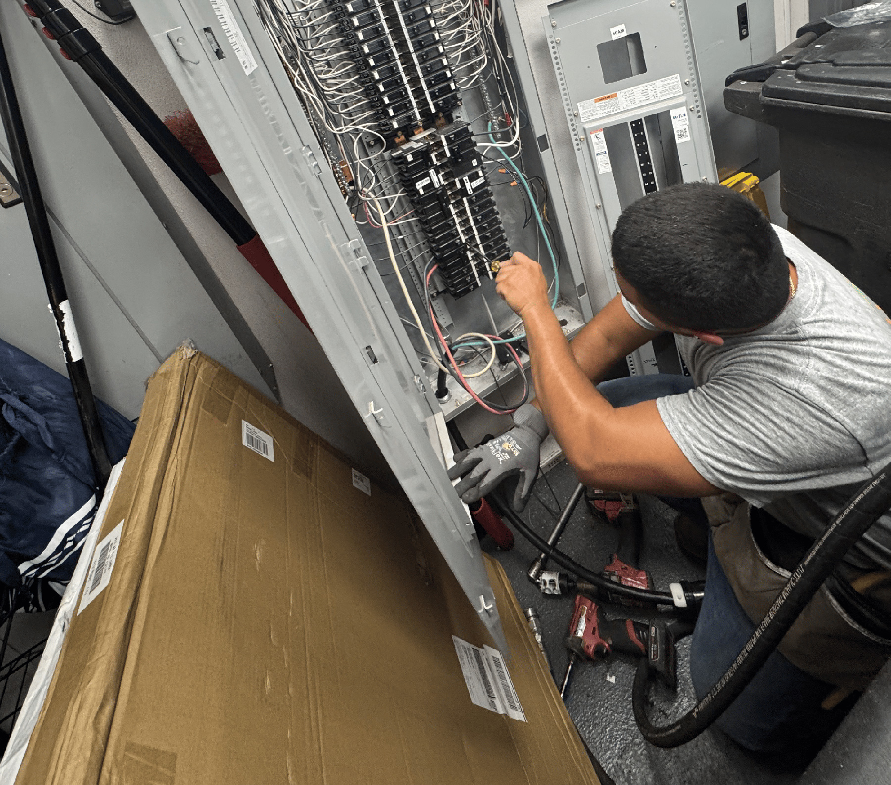 Person working on electrical panel