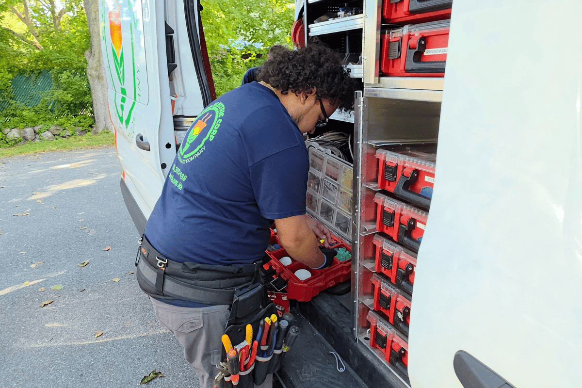 Licensed electrician performing winter electrical safety inspection in a Boston area home